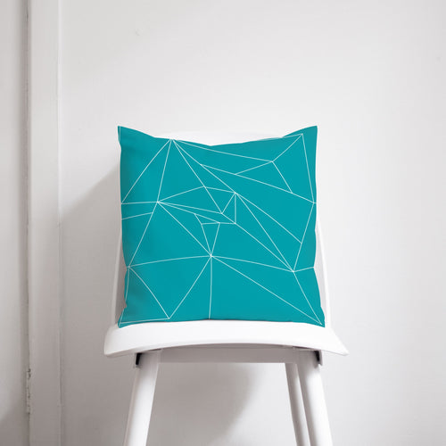Turquoise Cushion with a White Geometric Design